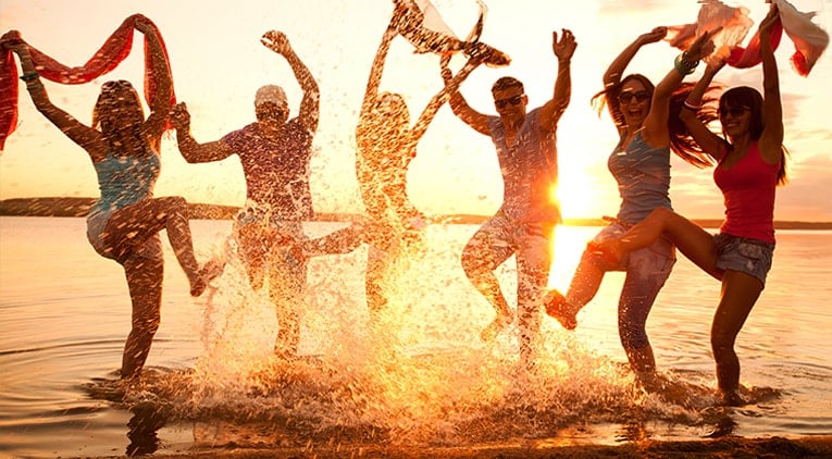 A group of travellers playing the the sea